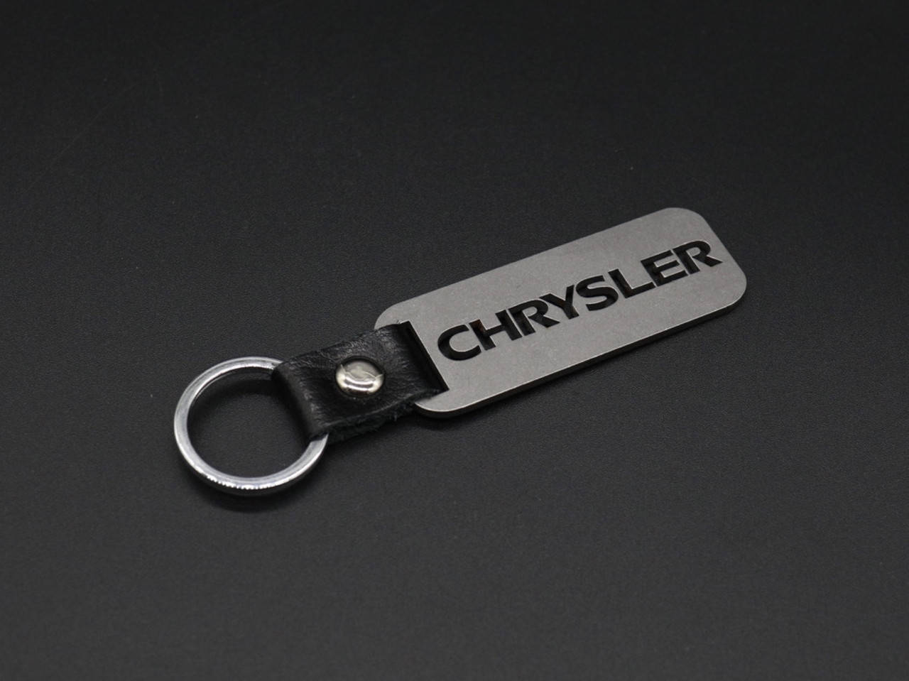 

Брелок металлический. Chrysler. 10х2,5см, Коричневый