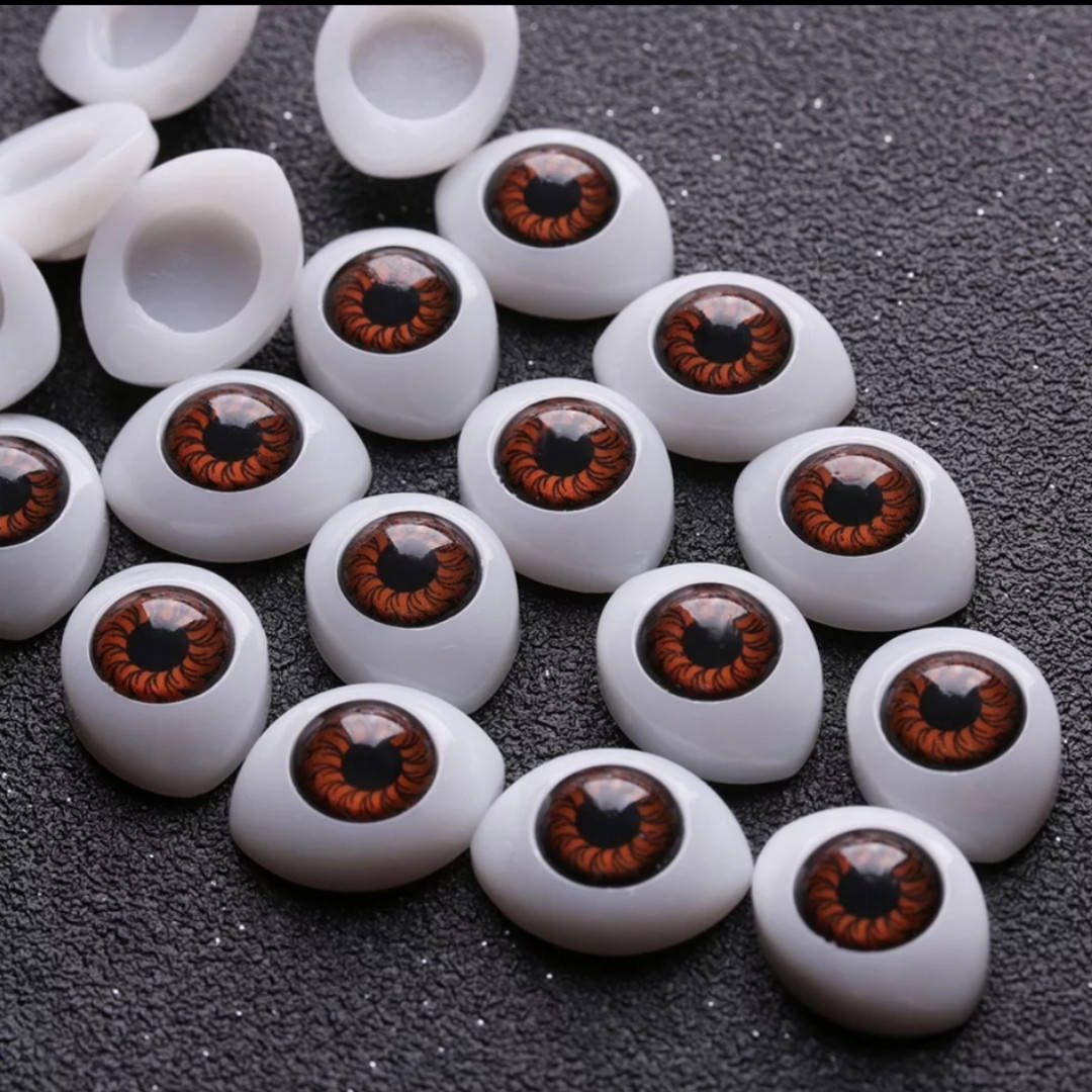 

Глазки "живые"для кукол , пластиковые,рыбки , карие . Размер 23/16