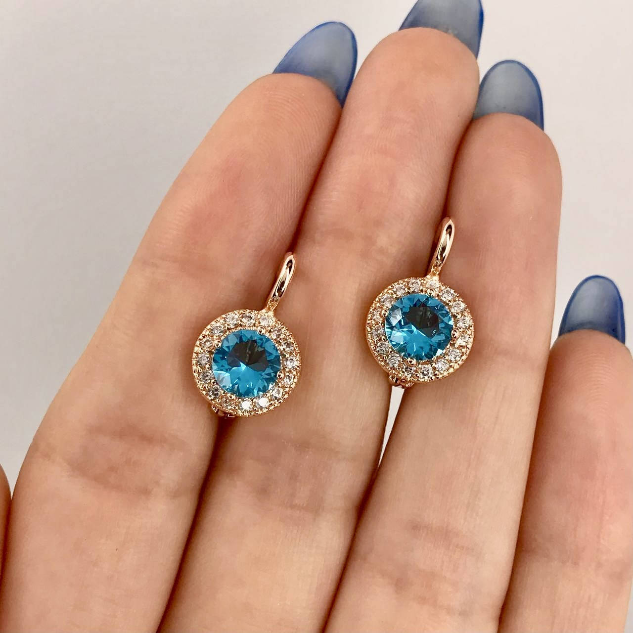 

Позолоченные серьги с аквамариновыми кристаллами Fallon 18к.