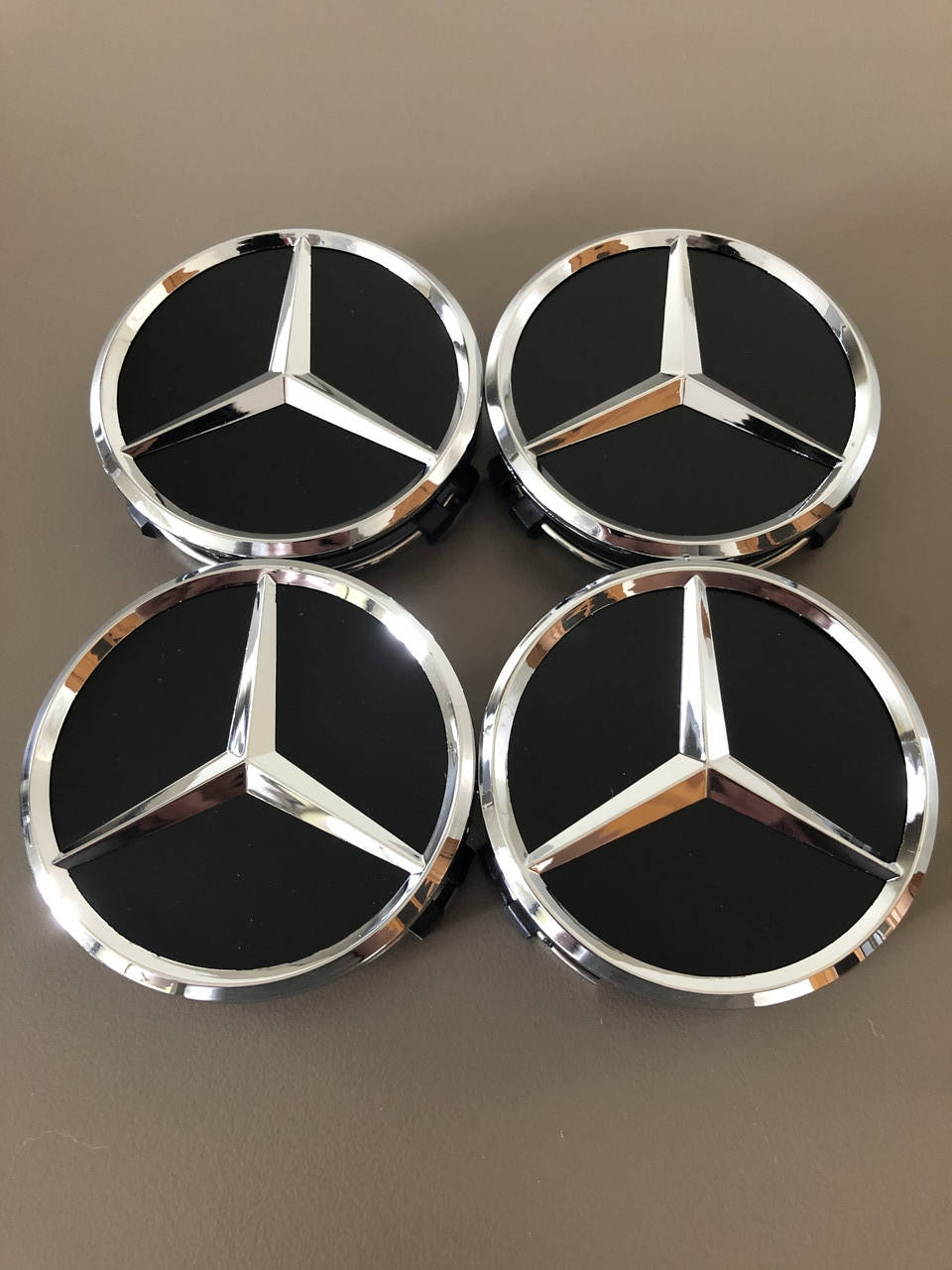 

Колпачки заглушки в диски Mercedes-Benz / Мерседес Хром черный мат 75/70/15мм. A2204000125