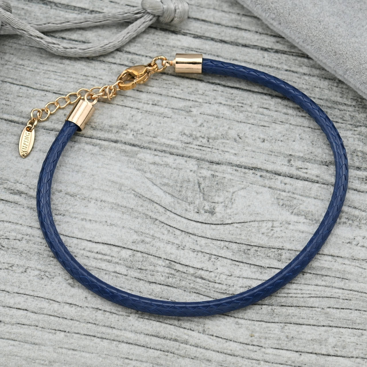 

Браслет из экокожи синий 36237 ширина 3 мм позолота 18К длина 19+3