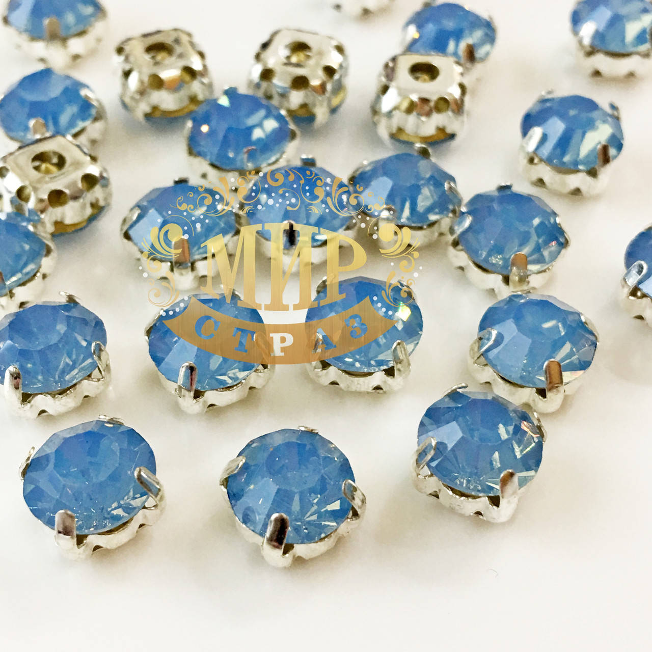 

Чатоны (стекло) в серебряных цапах 8мм, цвет Lt Sapphire Opal, Синий