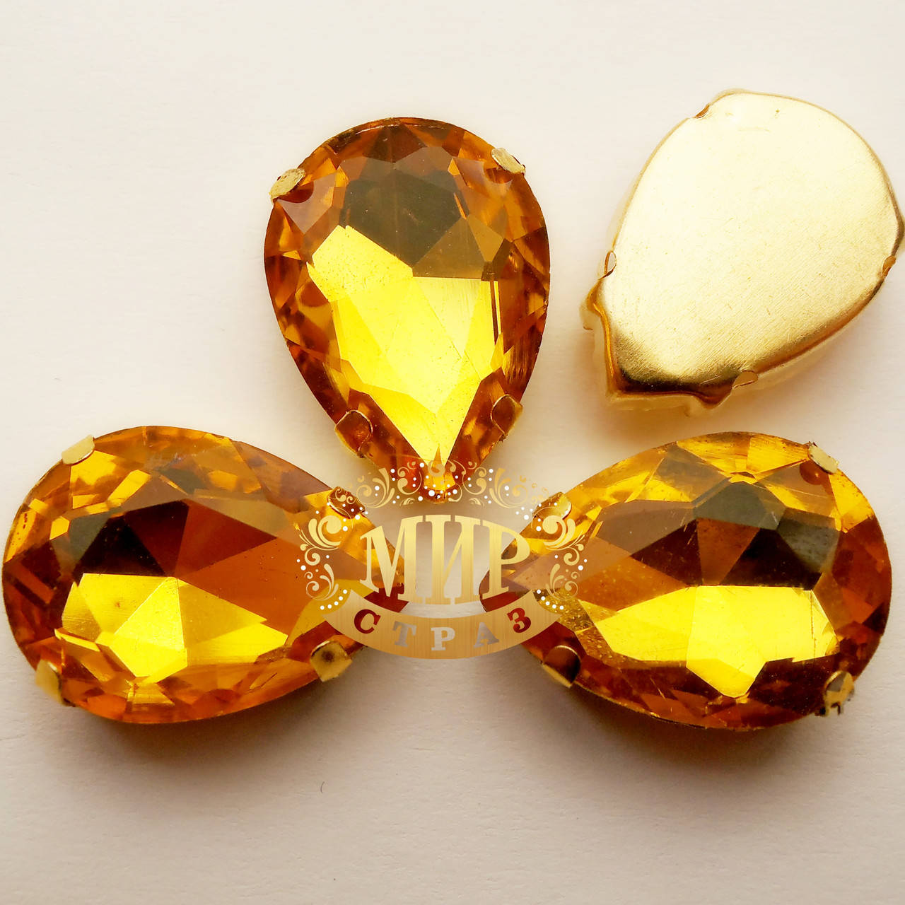

Стразы в золотых цапах Topaz, Размер 13x18мм*1шт