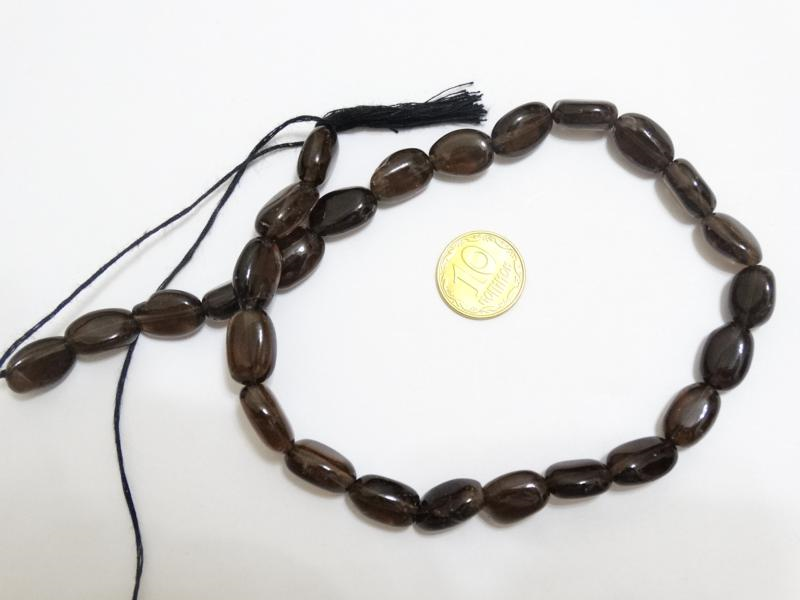 

Бусины на нитке из натурального камня Раухтопаз овал L=31см