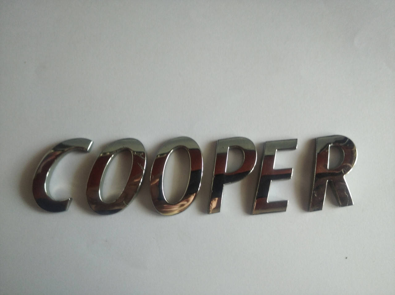 

Эмблема надпись Cooper царапины
